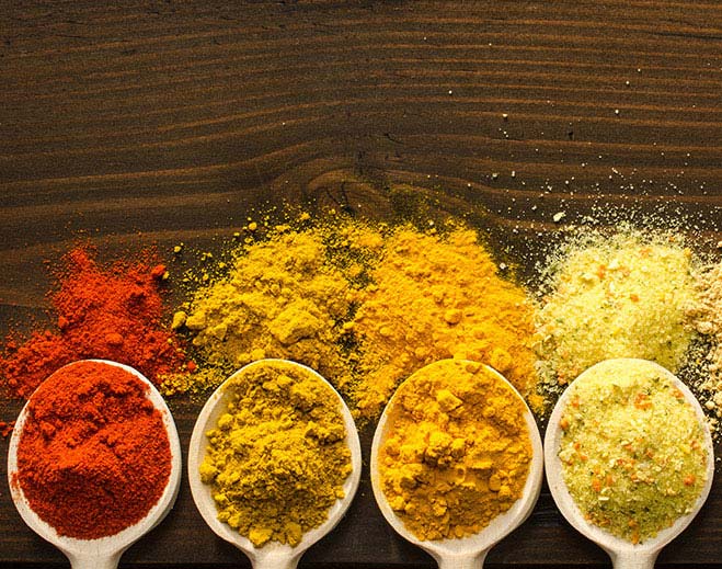 different spices in measuring spoons